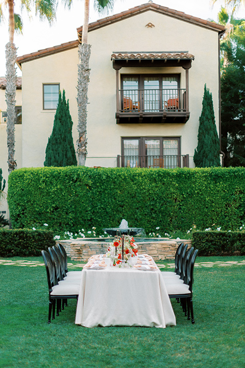  modern white and black wedding with pops of red – reception table and décor 