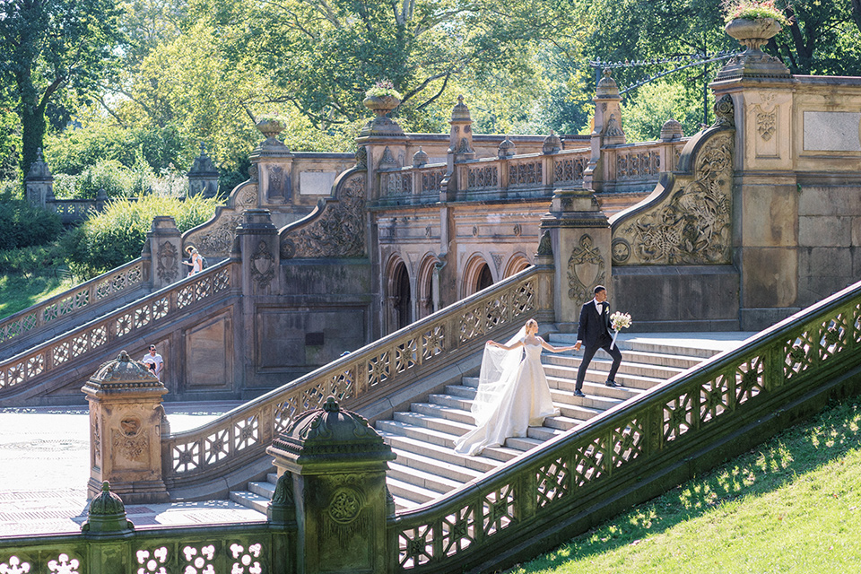  A dramatic modern black and white wedding in Central Park New York City – couple on stairs 
