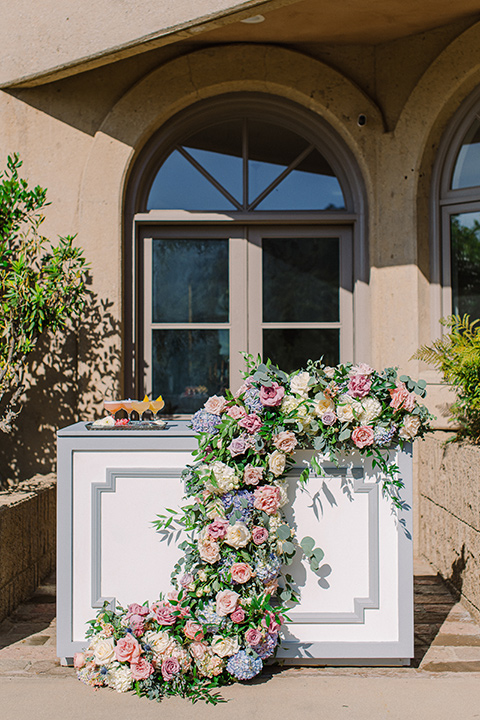  feminine spring editorial at a villa and the groom in a steel blue suit – bar and cocktails 