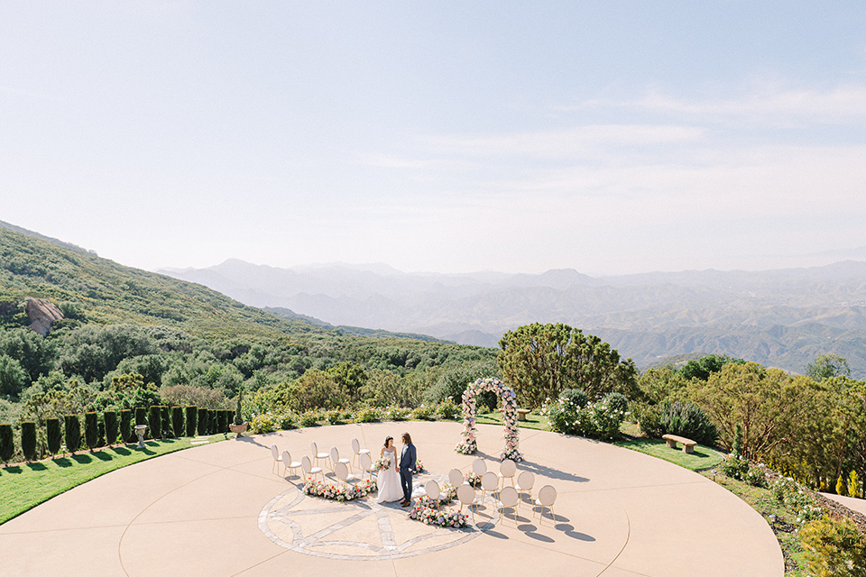  feminine spring editorial at a villa and the groom in a steel blue suit – ceremony