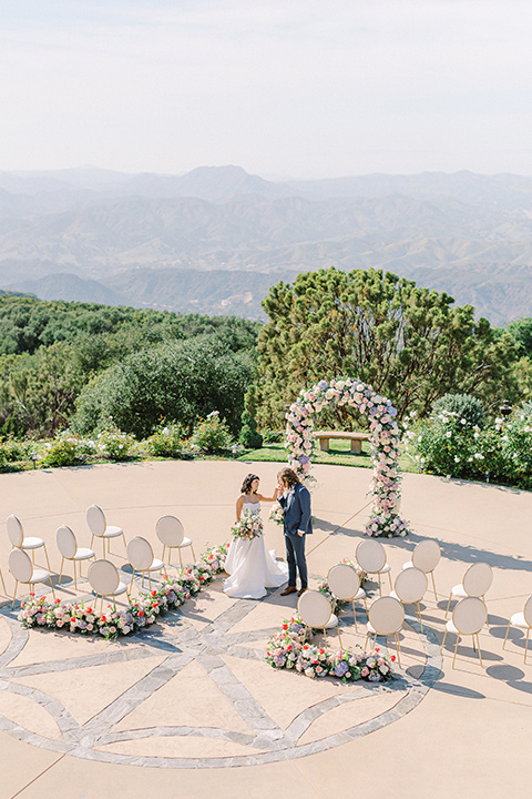 feminine spring editorial at a villa and the groom in a steel blue suit – ceremony 