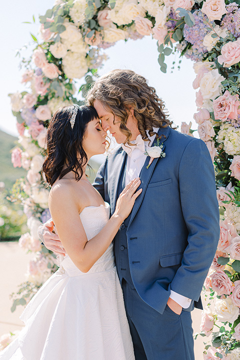  feminine spring editorial at a villa and the groom in a steel blue suit – ceremony 