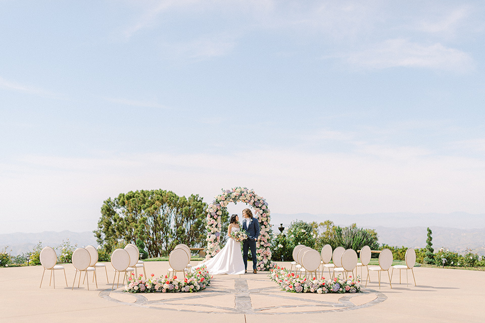  feminine spring editorial at a villa and the groom in a steel blue suit – ceremony