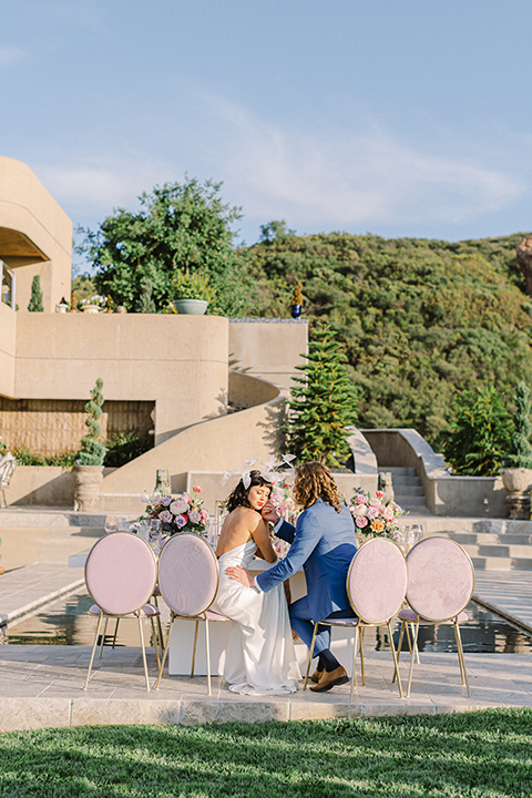  black and white beach wedding with lux details – couple by tables 