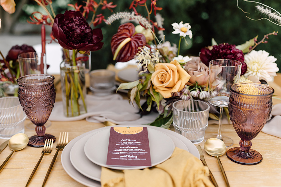  fig house shoot with burgundy and yellow details and the groom in a burgundy tuxedo – tablescape 