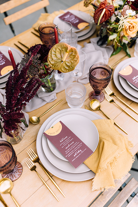  fig house shoot with burgundy and yellow details and the groom in a burgundy tuxedo – tables and flatware 