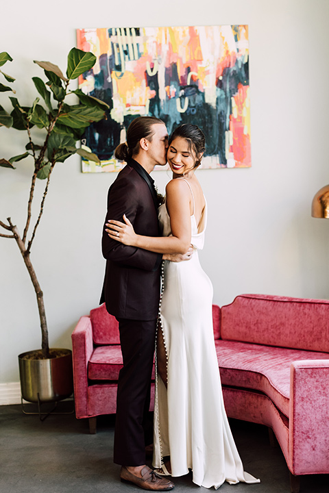  fig house shoot with burgundy and yellow details and the groom in a burgundy tuxedo – couple inside 