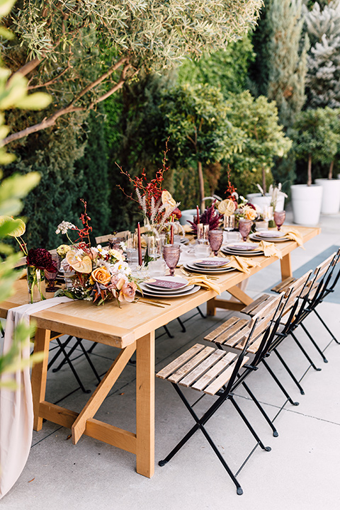  fig house shoot with burgundy and yellow details and the groom in a burgundy tuxedo – tables and flatware 