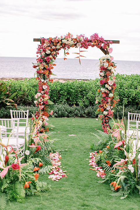  tropical tan and berry colored wedding in Hawaii – ceremony arch 