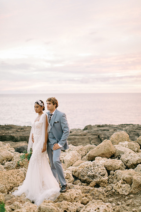  tropical tan and berry colored wedding in Hawaii – couple rocks 