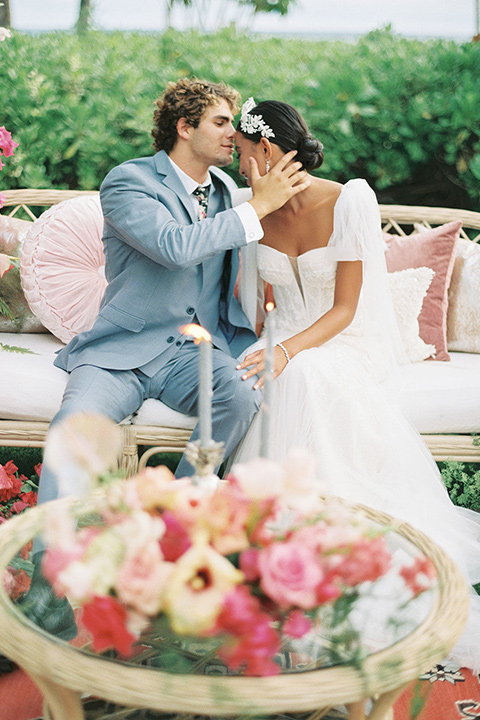  tropical tan and berry colored wedding in Hawaii – sitting at reception 