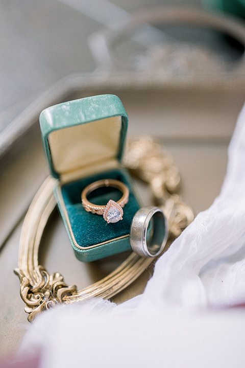  a burgundy and teal industrial winter wedding - rings and wedding invitations 