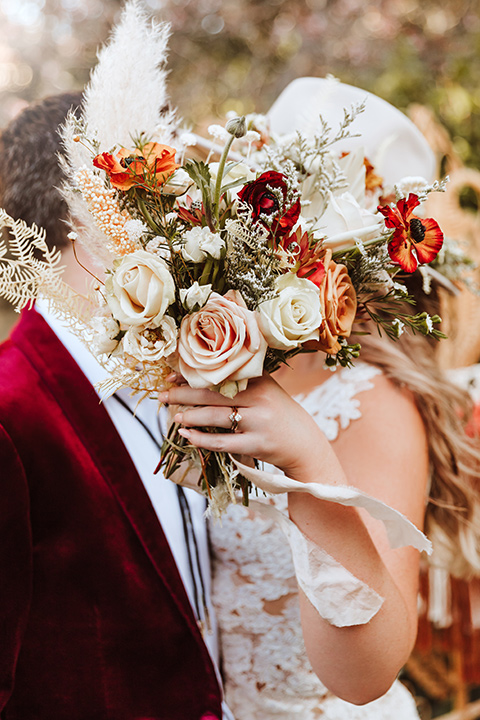  a burgundy and teal industrial winter wedding - couple at ceremony 