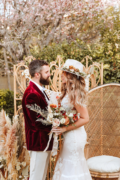  a burgundy and teal industrial winter wedding - couple at ceremony 