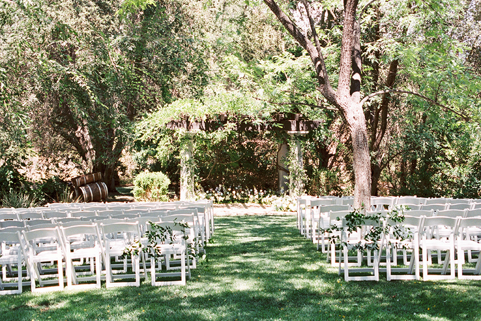  light blue and pink wedding with the groom in a light blue suit and the bride in a lace gown – ceremony décor 