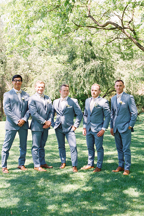  light blue and pink wedding with the groom in a light blue suit and the bride in a lace gown – groomsmen 