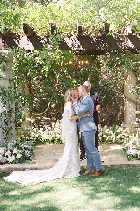  light blue and pink wedding with the groom in a light blue suit and the bride in a lace gown – ceremony 