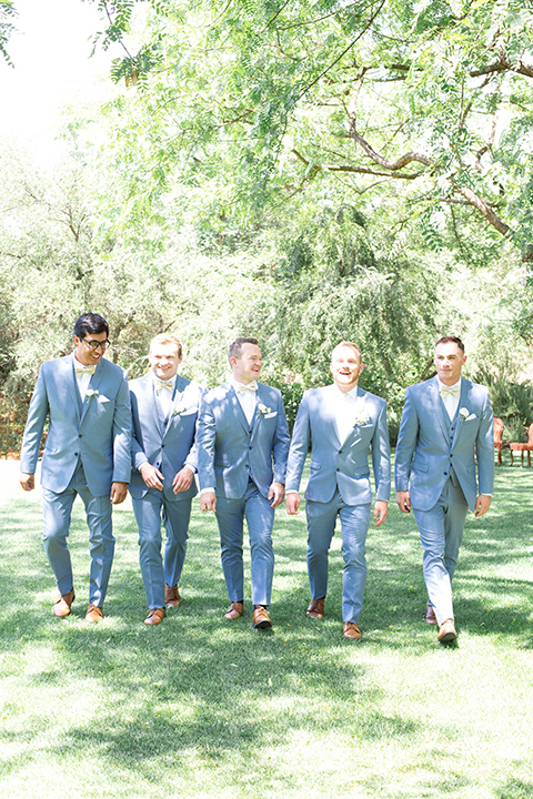  light blue and pink wedding with the groom in a light blue suit and the bride in a lace gown – groomsmen 