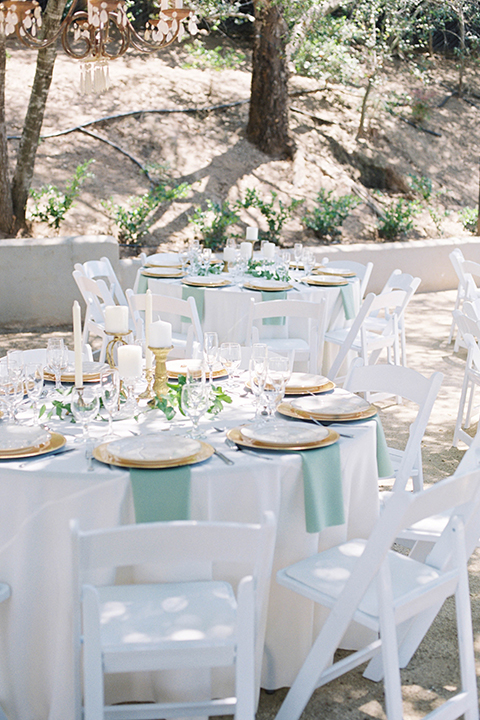  light blue and pink wedding with the groom in a light blue suit and the bride in a lace gown – table décor 