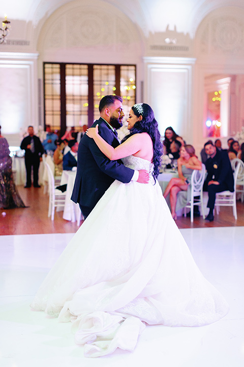  a royal black and rose grand wedding – couple dancing 