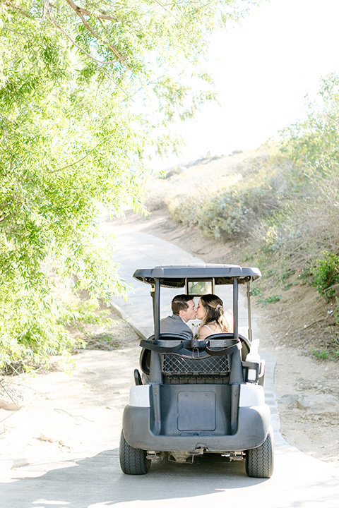  grey and dusty blue wedding with beachy touches – couple in the golf cart 