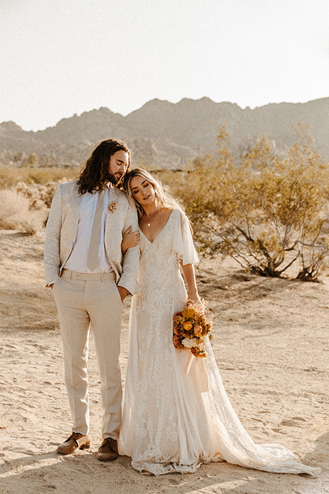  a dessert wedding in Joshua tree shown two ways: a modern black and white theme and a neutral gold and tan theme – boho bride and groom in the desert 