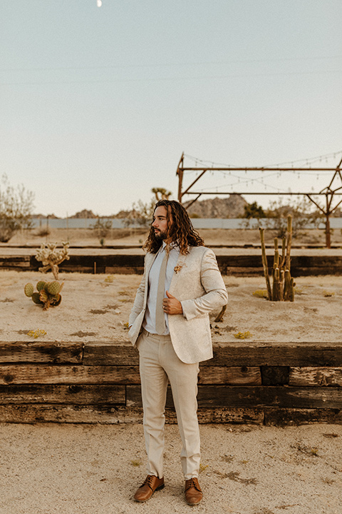  a dessert wedding in Joshua tree shown two ways: a modern black and white theme and a neutral gold and tan theme – ivory paisley groom 