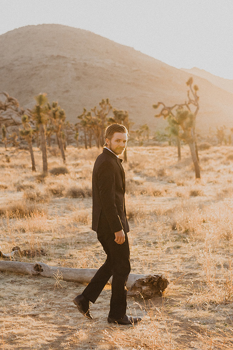  Joshua tree elopement with the bride in a sparkly gown and the groom in a black tuxedo– groom in tuxedo 