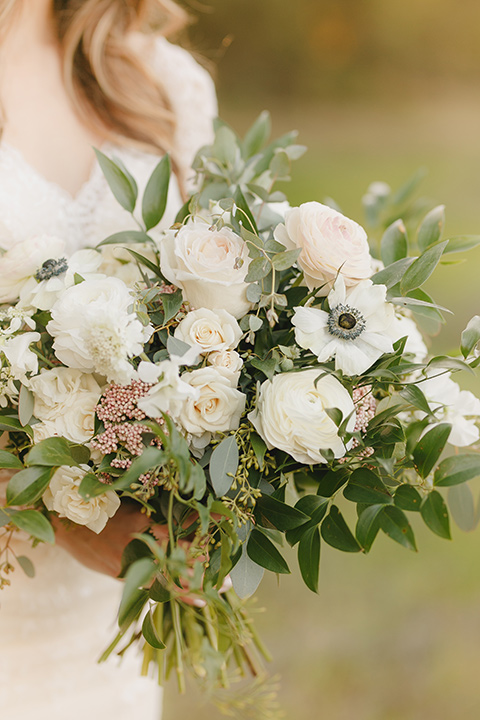  fairytale wedding in the meadow with the bride in a lace long sleeve gown and the groom in a slate blue and café brown look - bride 