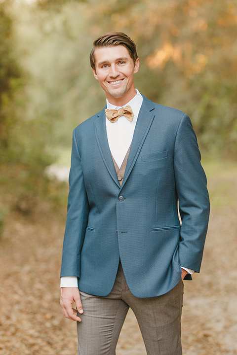  fairytale wedding in the meadow with the bride in a lace long sleeve gown and the groom in a slate blue and café brown look - bride 