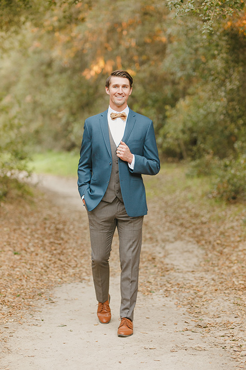  fairytale wedding in the meadow with the bride in a lace long sleeve gown and the groom in a slate blue and café brown look - bride 