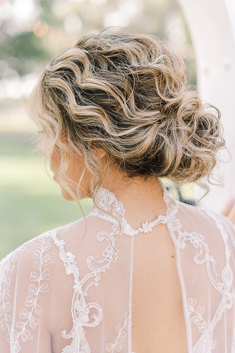  a romantic garden wedding at a Spanish inspired venue with the bride in a lace gown and the groom in a tan suit – bride in her gown