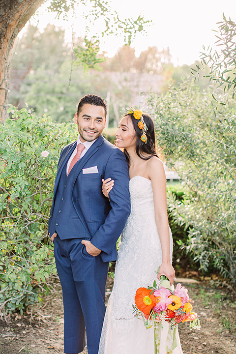  citrus blue and orange wedding with rustic tones – couple embracing 