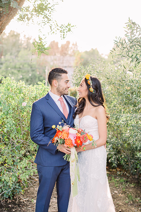  citrus blue and orange wedding with rustic tones – couple embracing 