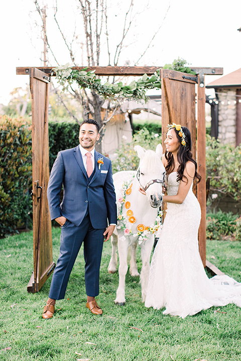  citrus blue and orange wedding with rustic tones – couple and the mini horse 