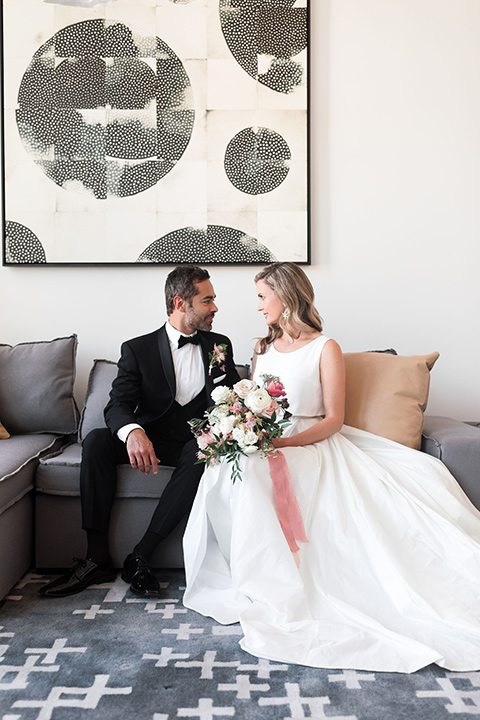  black and white wedding at the Laper Hotel – couple on the couch 