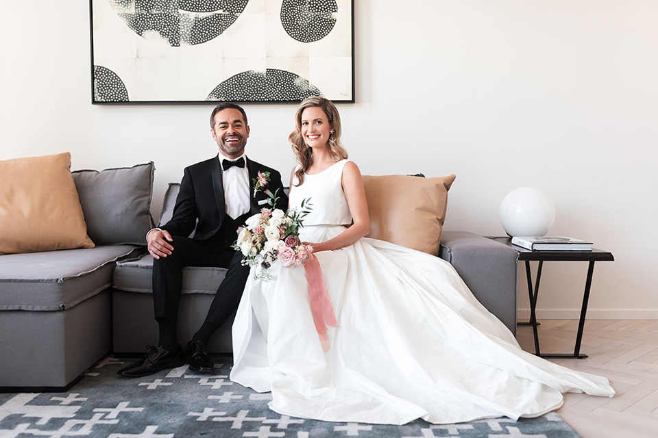  black and white wedding at the Laper Hotel – couple sitting on the couch