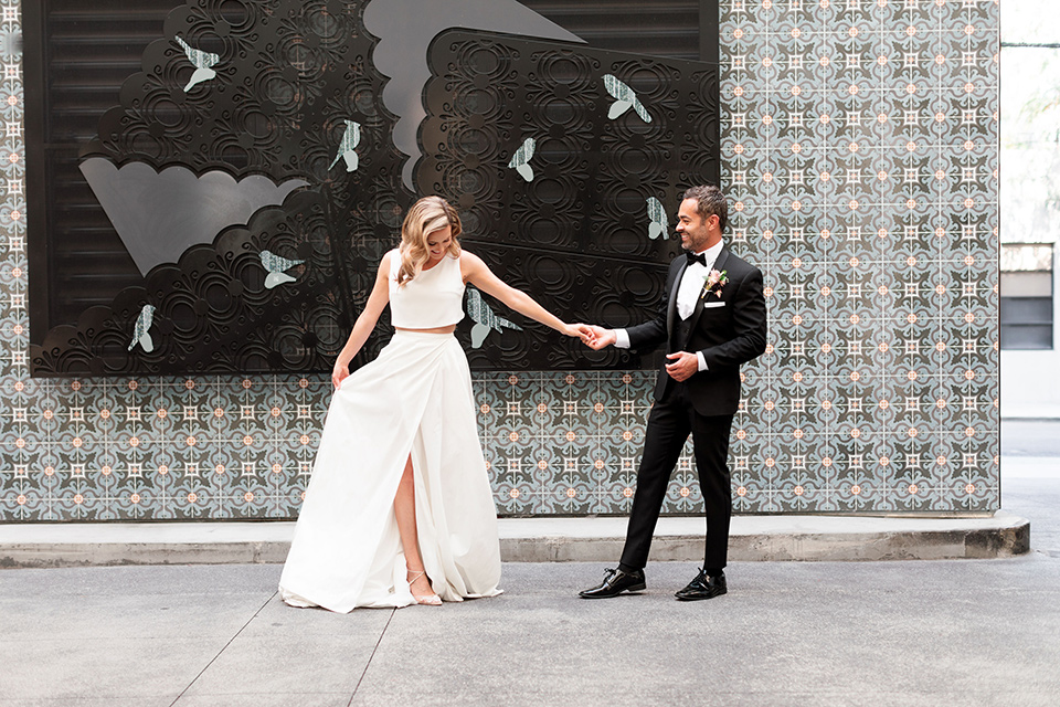  black and white wedding at the Laper Hotel – couple walking outside the venue
