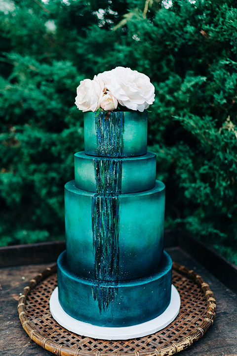  a greenery las vegas wedding at a rustic venue with the bride in an A-line gown and the groom in a green suit – cake