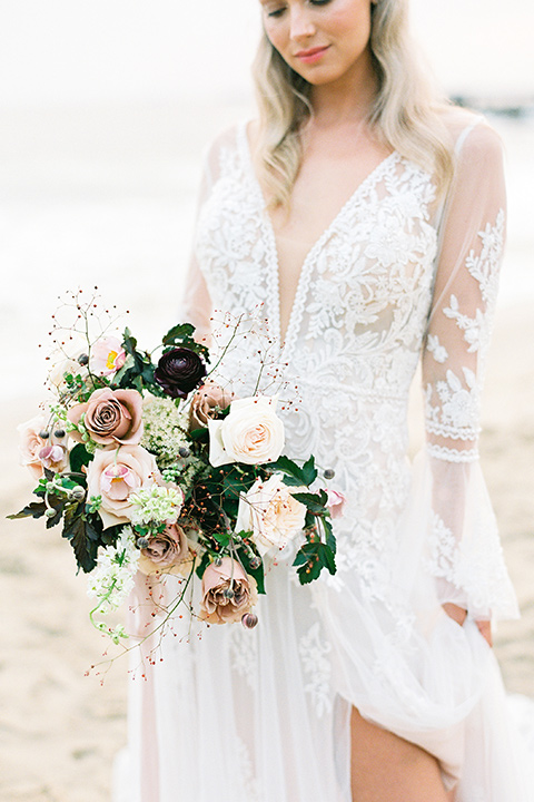  beach side wedding with the bride in a flowing lace gown and the groom in a white tuxedo – bride 