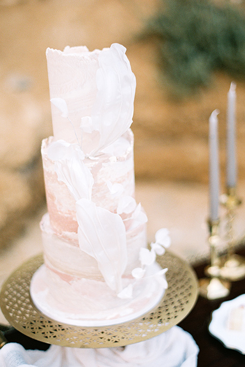  beach side wedding with the bride in a flowing lace gown and the groom in a white tuxedo – cake 