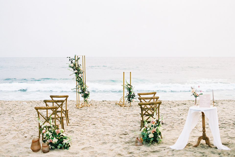  beach side wedding with the bride in a flowing lace gown and the groom in a white tuxedo – ceremony décor and space