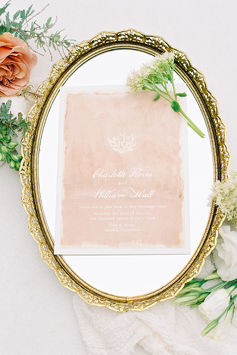  beach side wedding with the bride in a flowing lace gown and the groom in a white tuxedo – invitations 