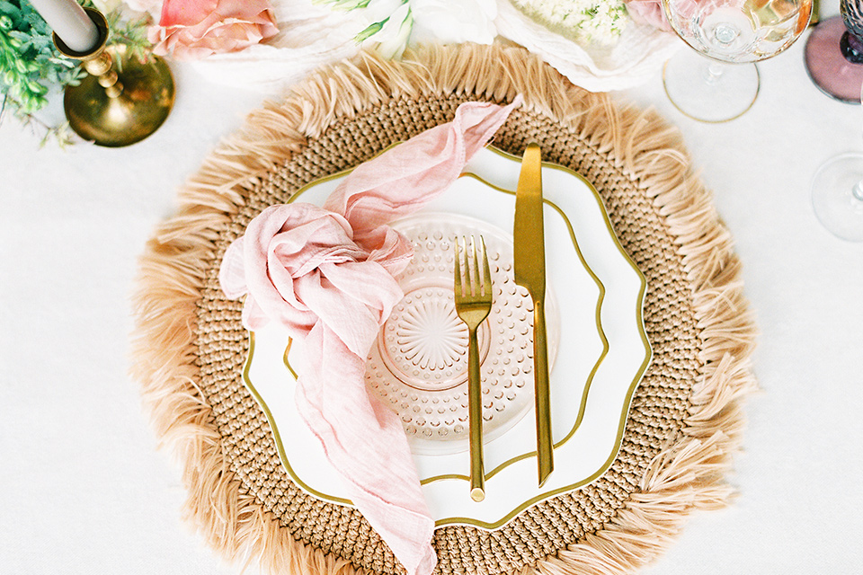  beach side wedding with the bride in a flowing lace gown and the groom in a white tuxedo – flatware