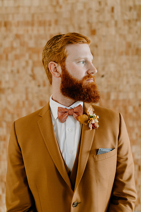  an amber toned wedding in san diego california with the bride in a modern fitted gown with cap sleeves and the groom in a caramel suit – groom in caramel suit 