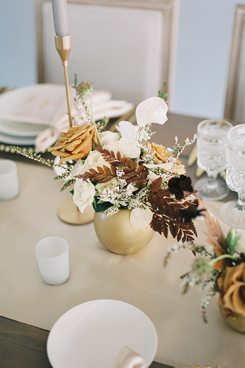  minimalistic nude wedding with vintage touches, the bride in a flowing gown with sleeves and the groom in a tan suit – table decor