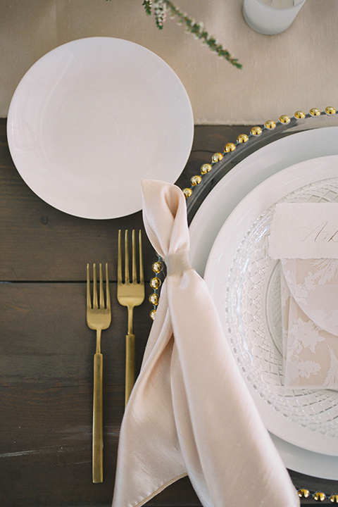  minimalistic nude wedding with vintage touches, the bride in a flowing gown with sleeves and the groom in a tan suit - flatware 