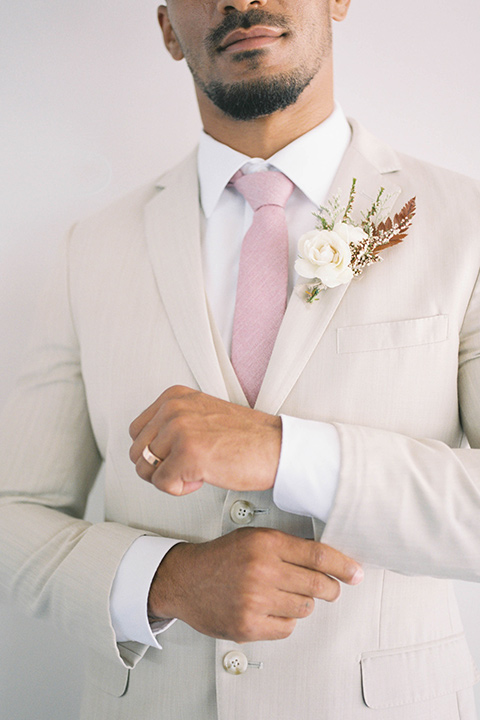  minimalistic nude wedding with vintage touches, the bride in a flowing gown with sleeves and the groom in a tan suit – groom 