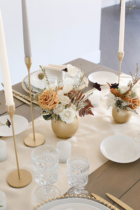  minimalistic nude wedding with vintage touches, the bride in a flowing gown with sleeves and the groom in a tan suit – table 