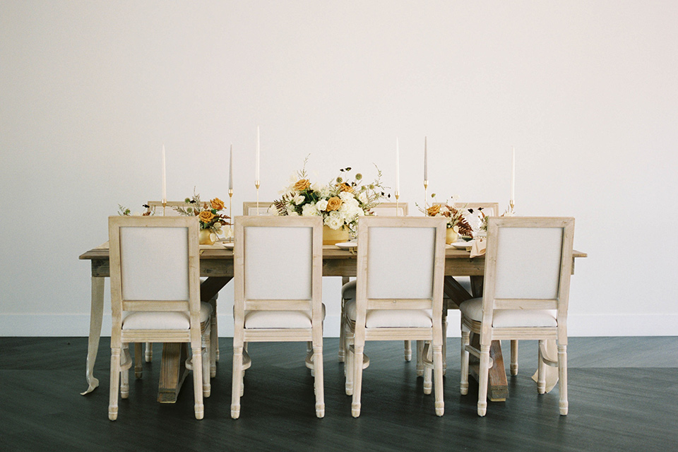  minimalistic nude wedding with vintage touches, the bride in a flowing gown with sleeves and the groom in a tan suit – tables